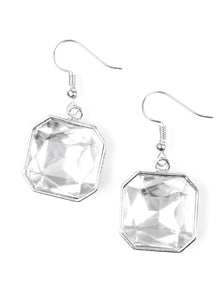 A faceted white gem is pressed into a glistening silver frame for a dramatic look. Earring attaches to a standard fishhook fitting. Sold as one pair of earrings.