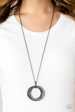 Load image into Gallery viewer, Featuring a hammered finish, a collection of interlocking gunmetal hoops are threaded through the center of textured gunmetal fittings. The dizzying pendant swings from the bottom of a lengthened gunmetal chain for a dramatic industrial look. Features an adjustable clasp closure.  Sold as one individual necklace. Includes one pair of matching earrings.  Always nickel and lead free.