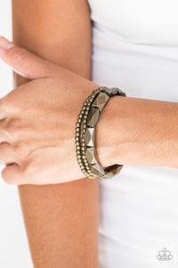 Dainty brass beads and faceted brass accents are threaded along stretchy bands and stacked across the wrist for a bold industrial look.  Sold as one set of three bracelets.  Always nickel and lead free.