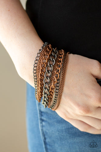 An assortment of mismatched copper and gunmetal chains have been strung between two hammered copper fittings, creating edgy layers around the wrist. Features an adjustable clasp closure.  Sold as one individual bracelet.  Always nickel and lead free.