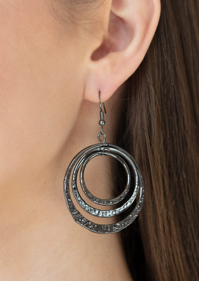 Featuring delicately hammered bottoms, a collection of shiny gunmetal hoops gradually increase in size as they dangle from the ear for a casual shine. Earring attaches to a standard fishhook fitting.  Sold as one pair of earrings. 