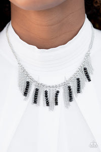 Threaded along metallic rods, stacks of black beading trickle from the bottom of a silver chain. The glittery accents trickle between trestles of silver chains, creating a fierce fringe below the collar. Features an adjustable clasp closure.  Sold as one individual necklace. Includes one pair of matching earrings.   Always nickel and lead free.