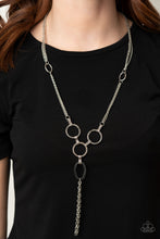 Load image into Gallery viewer, Hammered silver rings and ovals link into an industrial style pendant at the bottom of shimmery sections of silver chains. Classic silver chains stream from the bottom of the display, adding edgy movement. Features an adjustable clasp closure..  Sold as one individual necklace. Includes one pair of matching earrings.  Always nickel and lead free.