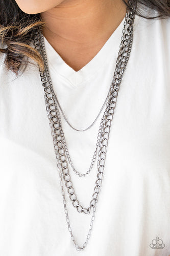 A mishmash of gunmetal chains drape across the chest for a collision of edgy textures. Features an adjustable clasp closure.  Sold as one individual necklace. Includes one pair of matching earrings.