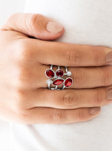 Varying in shape and cut, glassy white rhinestones and glittery red rhinestones tumble down the center of layered silver bands for an edgy look. Features a stretchy band for a flexible fit.  Sold as one individual ring.  Always nickel and lead free.