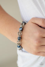 Load image into Gallery viewer, A collection of airy silver beads, faceted blue metallic beads, and white rhinestone encrusted rings are threaded along a stretchy band around the wrist for a glamorous look.  Sold as one individual bracelet. ﻿Always nickel and lead free.