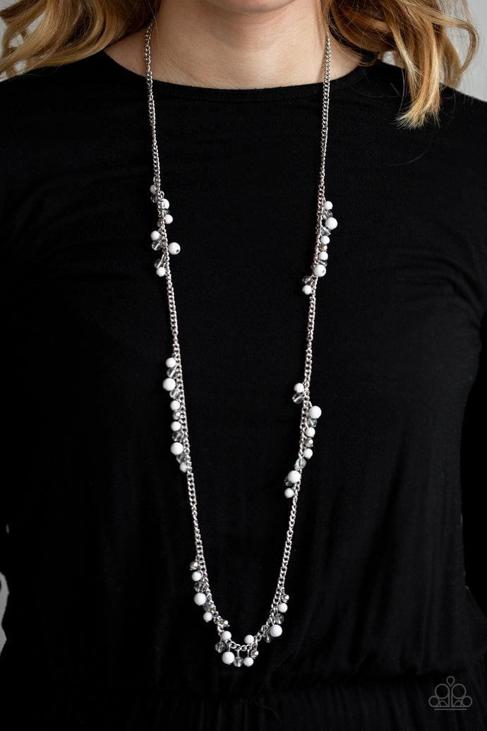 Sections of shiny silver, polished white, and glassy beads trickle along a shimmery silver chain along the chest for a flirtatious look. Features an adjustable clasp closure.  Sold as one individual necklace. Includes one pair of matching earrings.  Always nickel and lead free.
