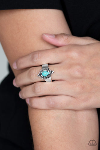Chiseled into a tranquil teardrop, a refreshing turquoise stone is pressed into the center of a dainty silver band for a seasonal look. Features a dainty silver band for a flexible fit.   Sold as one individual ring.