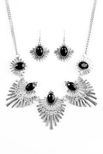 Load image into Gallery viewer, Textured metal bars flare out from a mesmerizing black gem, creating a fringe of fanning frames. Sprinkled with white rhinestones, the dazzling display falls just below the collar for a sassy finish. Features an adjustable clasp closure  Sold as one individual necklace. Includes one pair of matching earrings.