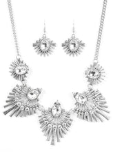 Load image into Gallery viewer, Textured metal bars flare out from a mesmerizing gem, creating a fringe of fanning frames. Sprinkled with matching white rhinestones, the dazzling display falls just below the collar for a sassy finish. Features an adjustable clasp closure.  Sold as one individual necklace. Includes one pair of matching earrings.