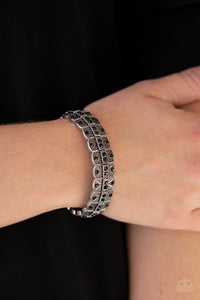 Encrusted in glittery black rhinestones, ornately studded silver frames are threaded along stretchy bands for an edgy-glamorous look.  Sold as one individual bracelet.  Always nickel and lead free.