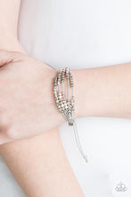 Load image into Gallery viewer, A collection of dainty silver beads and glistening silver cubes are threaded along strands of shiny gray cording around the wrist for a minimalist inspired look. Features an adjustable sliding knot closure.  Sold as one individual bracelet.  Always nickel and lead free.