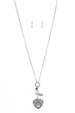 Load image into Gallery viewer, Infused with pink cat&#39;s eye accents, a dainty silver heart, rectangular frame stamped with &quot;love&quot;, and a locket-like heart stamped with the word &quot;mom&quot;, collect at the bottom of a silver chain for a vintage inspired look. Features an adjustable clasp closure.  Sold as one individual necklace. Includes one pair of matching earrings.  