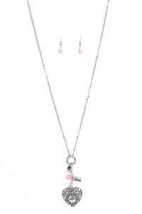 Infused with pink cat's eye accents, a dainty silver heart, rectangular frame stamped with "love", and a locket-like heart stamped with the word "mom", collect at the bottom of a silver chain for a vintage inspired look. Features an adjustable clasp closure.  Sold as one individual necklace. Includes one pair of matching earrings.  
