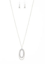 Load image into Gallery viewer, Ringed in a studded silver frame, glittery white rhinestones collect into glamorous pendant at the bottom of a lengthened silver chain for a refined flair. Features an adjustable clasp closure.  Sold as one individual necklace. Includes one pair of matching earrings.   Always nickel and lead free.