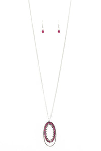 Ringed in a studded silver frame, glittery pink and hematite rhinestones collect into a glamorous pendant at the bottom of a lengthened silver chain for a refined flair. Features an adjustable clasp closure.  Sold as one individual necklace. Includes one pair of matching earrings.