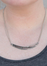 Load image into Gallery viewer, Dotted and hammered silver bars crisscross below the collar, coalescing into an edgy crescent-shaped pendant. Features an adjustable clasp closure.  Sold as one individual necklace. Includes one pair of matching earrings.