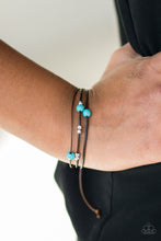 Load image into Gallery viewer, Shiny silver beads and refreshing turquoise stones are threaded along shiny black cording, creating dainty layers across the wrist. Features an adjustable sliding knot closure.  Sold as one individual bracelet.  Always nickel and lead free.