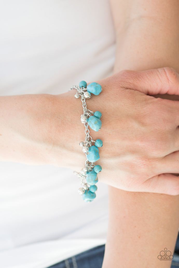 Varying in shape and size, shiny silver beads and refreshing turquoise stone beading swing from a shimmery silver chain, creating a colorful fringe around the wrist. Features an adjustable clasp closure.  Sold as one individual bracelet.  Always nickel and lead free.