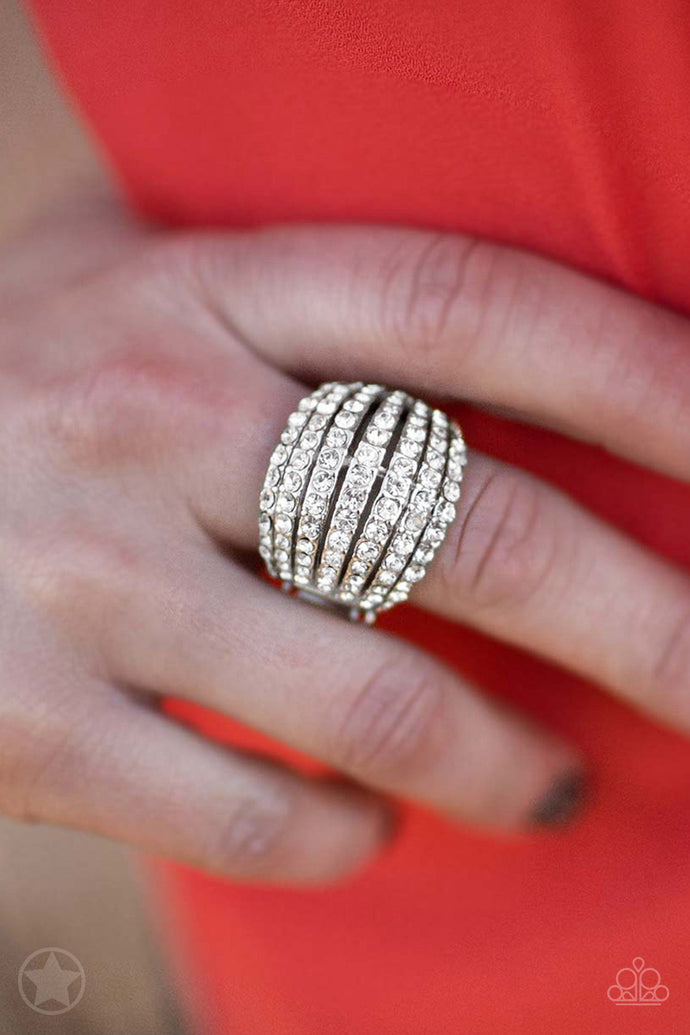 Row after row of incandescent white rhinestones stack into a dazzling display. The gorgeous rounded bands and undeniable sparkle create a regal statement piece. Features a stretchy band for a flexible fit.  Sold as one individual ring.  Always nickel and lead free.