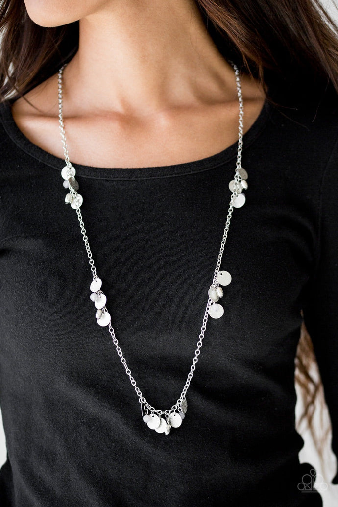 Delicately hammered in blinding shimmer, glittery silver discs join gray crystal-like beading along a shiny silver chain for a whimsical look. Features an adjustable clasp closure.  Sold as one individual necklace. Includes one pair of matching earrings.