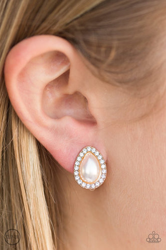 Glittery white rhinestones spin around a pearly teardrop center, creating a timeless palette. Earring attaches to a standard clip-on fitting.  Sold as one pair of clip-on earrings.  Always nickel and lead free.