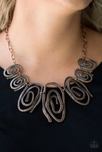Load image into Gallery viewer, Delicately hammered in shimmery detail, warped copper frames spin into dizzying spirals. Gradually increasing in size near the center, the asymmetrical frames link below the collar for a bold tribal inspired look. Features an adjustable clasp closure.  Sold as one individual necklace. Includes one pair of matching earrings.  Always nickel and lead free.