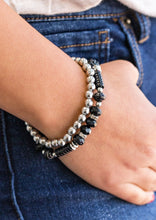 Load image into Gallery viewer, A classic strand of silver beading joins with a strand of beautiful black beading. Infused with crystal like beading, rings and beads encrusted in dazzling white and black rhinestones are sprinkled along the colorful band for a whimsical finish.  Sold as one set of two bracelets  