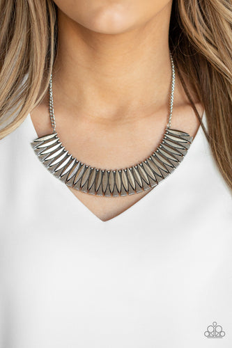 Infused with dainty silver studs, sleek geometric silver plates connect with hammered silver triangles, creating a fierce half-moon plate below the collar. Features an adjustable clasp closure.  Sold as one individual necklace. Includes one pair of matching earrings.  Always nickel and lead free.