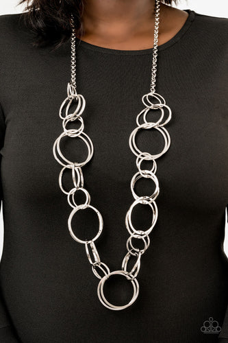   Pairs of dramatically oversized silver hoops connect across the chest, creating an elegantly elongated statement piece for a fearless look. Features an adjustable clasp closure.  Sold as one individual necklace. Includes one pair of matching earrings.  Always nickel and lead free.