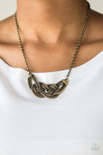 Load image into Gallery viewer, Featuring chain-like patterns, antiqued brass bars knot below the collar for a bold industrial look. Features an adjustable clasp closure.  Sold as one individual necklace. Includes one pair of matching earrings.  Always nickel and lead free.