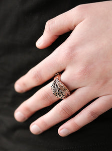 Brushed in an antiqued shimmer, a lifelike copper leaf curls across the finger in a seasonal fashion. Features a dainty stretchy band for a flexible fit.  Sold as one individual ring.