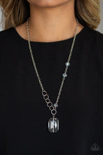 Load image into Gallery viewer, A trio of glassy white crystal-like beads asymmetrically trickle along a mismatched silver chain. Featuring a regal emerald-cut, an oversized white gem swings from the bottom of the silver chain for a glamorous finish. Features an adjustable clasp closure.  Sold as one individual necklace. Includes one pair of matching earrings.  Always nickel and lead free.  Life of the Party January 2020