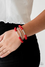 Load image into Gallery viewer, Polished red beads and mismatched silver beads are threaded along stretchy bands, creating colorful layers across the wrist.  Sold as one set of three bracelets.  Always nickel and lead free.