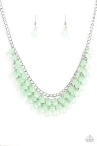 Rows of refreshing green teardrops cascade from the bottom of a shimmery silver chain, creating a flirty fringe below the collar. Features an adjustable clasp closure.  Sold as one individual necklace. Includes one pair of matching earrings.