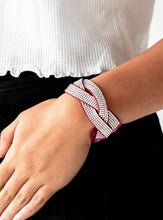 Load image into Gallery viewer, Encrusted in row after row of glittery white rhinestones, three pink suede bands braid across the wrist for a sassy look. Features an adjustable snap closure.  Sold as one individual bracelet.   Always nickel and lead free.