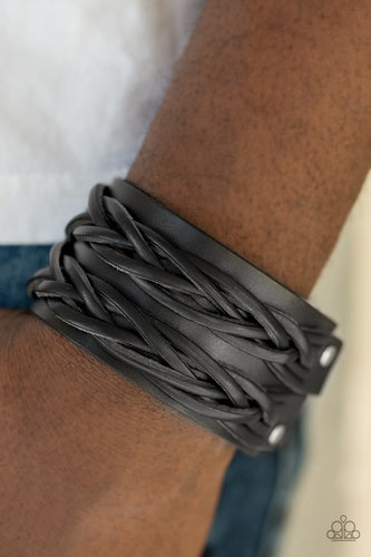 Strands of braided leather bands are studded across the front of a thick leather band for a rugged urban look. Features an adjustable snap closure.  Sold as one individual bracelet.  Always nickel and lead free.