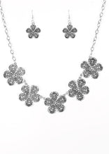 Load image into Gallery viewer, Featuring lace-like petals, glistening silver daisies link below the collar for a seasonal look. Features an adjustable clasp closure.  Sold as one individual necklace. Includes one pair of matching earrings.
