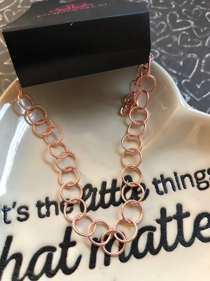 Brushed in an antiqued shimmer, dainty copper links join around the wrist in a minimal inspired fashion. Features an adjustable clasp closure.  Sold as one individual bracelet.  Always nickel and lead free.