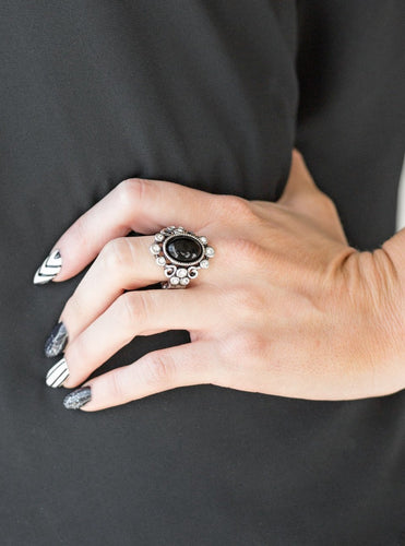 A polished black bead is pressed into a bubbly silver frame radiating with glassy white rhinestones for a notable finish. Features a stretchy band for a flexible fit.  Sold as one individual ring.  Always nickel and lead free.