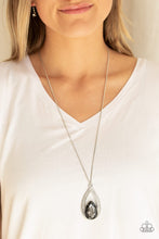 Load image into Gallery viewer, A smoky teardrop gem is pressed into a silver frame radiating with glassy white rhinestones. The glamorous pendant swings from the bottom of a shimmery silver chain for a refined look. Features an adjustable clasp closure.  Sold as one individual necklace. Includes one pair of matching earrings.  