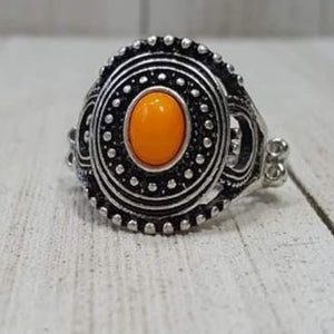 A shiny orange bead is pressed into the center of a round frame radiating with silver studded detail for a seasonal look. Features a dainty stretchy band for a flexible fit.  Sold as one individual ring.  Always nickel and lead free  Fashion Fix Exclusive!!
