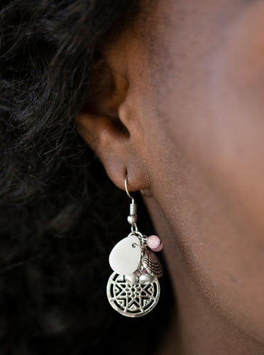 A collection of pearly silver seed beads, a shell-like teardrop, and pink cat's eye beads trickle from the ear. Brushed in a shimmery finish, a silver seashell and nautical inspired frame are added to the clustered fringe for a whimsical finish. Earring attaches to a standard fishhook fitting.  Sold as one pair of earrings.  