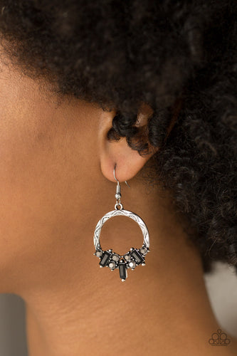 Featuring round and emerald style cuts, radiant hematite and black rhinestones are encrusted along the bottom of an ornate silver hoop for an edgy look. Earring attaches to a standard fishhook fitting.  Sold as one pair of earrings.  Always nickel and lead free. 