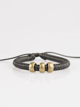 Load image into Gallery viewer, Shiny black twine wraps around a black cord, creating an urban look around the wrist. Shiny brass beads slide along the cording for a rugged finish. Features an adjustable sliding knot closure.  Sold as one individual bracelet.