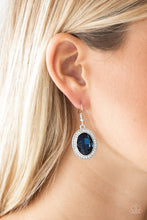 Load image into Gallery viewer, An over-sized blue gem is pressed into the center of a silver frame radiating with glassy white rhinestones for a glamorous look. Earring attaches to a standard fishhook fitting.  Sold as one pair of earrings.  Always nickel and lead free. 