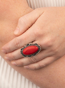 A fiery red stone is pressed into an ornate silver frame rippling with studded and serrated textures for a seasonal flair. Features a stretchy band for a flexible fit.  Sold as one individual ring.