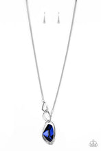 Load image into Gallery viewer, A faceted blue gem is nestled inside of a shimmery silver frame encrusted in dainty white rhinestones. The glittery pendant asymmetrically links with abstract silver frames at the bottom of a lengthened silver rounded snake chain for a modern look. Features an adjustable clasp closure.  Sold as one individual necklace. Includes one pair of matching earrings.  