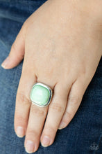 Load image into Gallery viewer, An oversized Green Ash bead is pressed into the center of a square silver frame, creating a powerful pop of color atop the finger. Features a stretchy band for a flexible fit.  Sold as one individual ring  Always nickel and lead free.   Fashion Fix Exclusive August 2021