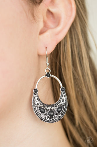 Chiseled into round and teardrop shapes, neutral black stones are pressed into the bottom of a delicately hammered silver lure for a seasonal look. Earring attaches to a standard fishhook fitting.  Sold as one pair of earrings.  Always nickel and lead free.